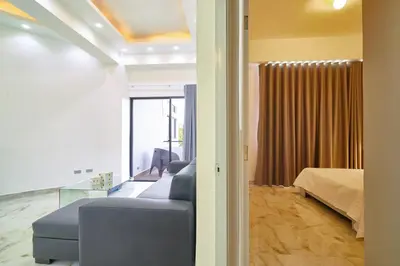 a living room with a couch and a bed at spectacular sea view in Santo Domingo