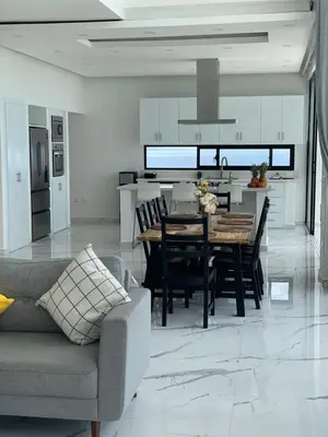 a kitchen and dining room with a table and chairs at Villa Ocean Blue in Las Terrenas
