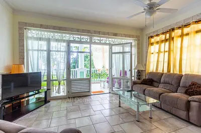 a living room with a couch and a television at 