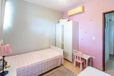 a small bedroom with a bed and a table at 