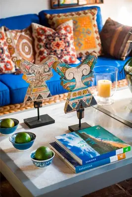 a table with two crosses on it with books at Casas del XVI in Santo Domingo