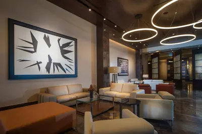 a lobby with couches and tables in a building at JW Marriott Hotel Santo Domingo in Santo Domingo