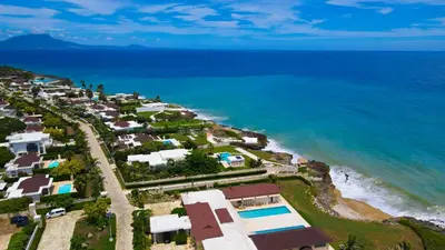 an aerial view of a beach with houses and the ocean at Sosua Ocean Village, Villa 9 Campo Del Mar , IV in Sosúa