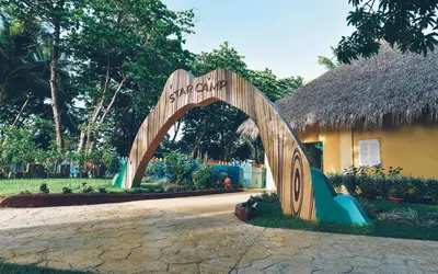 a wooden archway in front of a building at Iberostar Waves Costa Dorada - All Inclusive in San Felipe de Puerto Plata