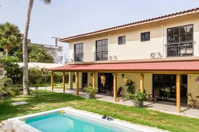 an exterior view of a house with a swimming pool at Villas Elim A and B in Cabrera