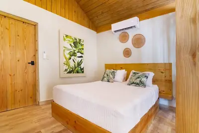 a bedroom with a bed and a wooden ceiling at Hacienda La Huerta, Puerto Plata in San Felipe de Puerto Plata