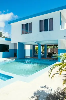 a house with a swimming pool in front of it at Parador El Ermitaño in Santa Bárbara de Samaná