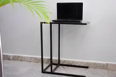 a black table with a laptop on top of it at Apartamento entero en Samaná Los tios 1 y 2 in Santa Bárbara de Samaná