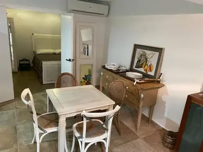 a dining room with a table and chairs and a bedroom at Amazing apartment, B-Juan Dolio, El Bonio II in Juan Dolio