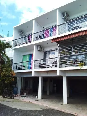 a white building with balconies on the side of it at Appart-hotel Veras Samana No-14 in Santa Bárbara de Samaná