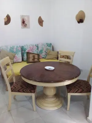 a table and chairs with a couch in a living room at Appart-hotel Veras Samana No-14 in Santa Bárbara de Samaná