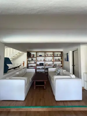 a living room with two white couches and a table at ITAKA LOMA BONITA in Las Terrenas
