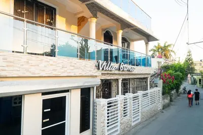 a building with a sign that reads wild sauce at Villa Gumio Studio Apt - 7 minutes walk to Boca Chica Beach apts in Boca Chica