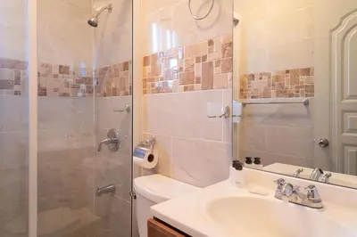 a bathroom with a shower and a sink and a toilet at Villa Gumio Studio Apt - 7 minutes walk to Boca Chica Beach apts in Boca Chica