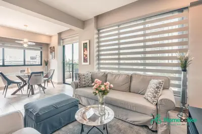 a living room with a couch and a table at Regatta Living II with Breakfast Included! - 502 in Los Prados