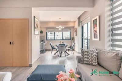 a living room with a couch and a table at Regatta Living II with Breakfast Included! - 502 in Los Prados