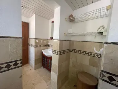 a bathroom with a sink and a toilet at Laguna Golf in Punta Cana