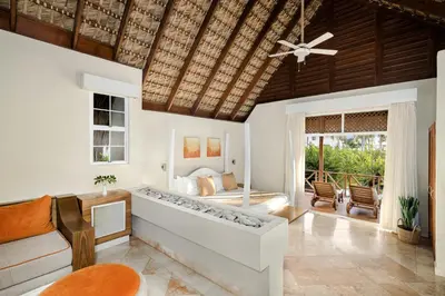 a bedroom with a bed and a ceiling fan at Sunscape Dominicus La Romana - All Inclusive in Bayahibe