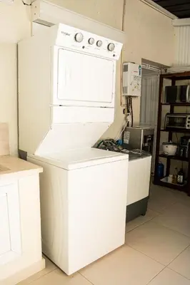 a kitchen with a white stove and a white refrigerator at Habitación privada en Puerto Plata Bayardo in San Felipe de Puerto Plata