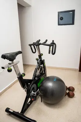 a exercise bike sitting on the floor in a room at Apartamento Los Anturios en Puerto Plata Bayardo in San Felipe de Puerto Plata