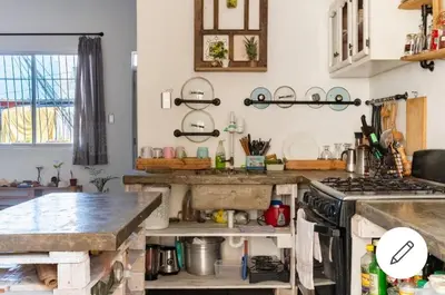 a kitchen with a sink and a counter top at Room in the Colonial Zone in Santo Domingo
