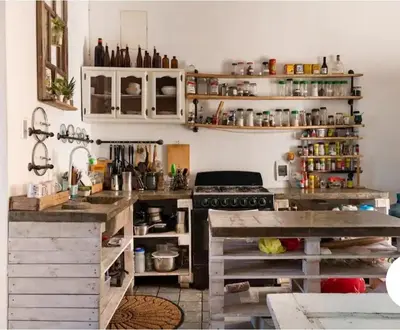 a kitchen with white cabinets and a counter top at Room in the Colonial Zone in Santo Domingo