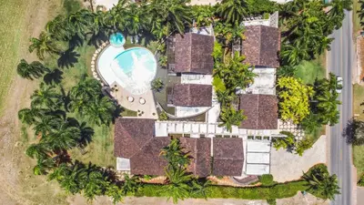 an aerial view of a resort with a pool at Luxurious 8-BR Villa with Ocean View, Jacuzzi, Home Cinema and Resort Access in Casa de Campo in La Romana