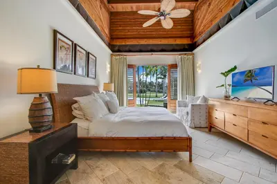 a bedroom with a bed and a ceiling fan at Luxurious 8-BR Villa with Ocean View, Jacuzzi, Home Cinema and Resort Access in Casa de Campo in La Romana