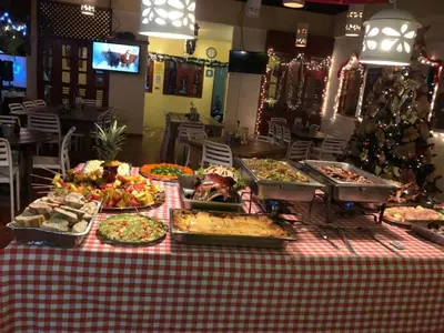 a table with many different types of food on it at Hotel Voramar in Sosúa