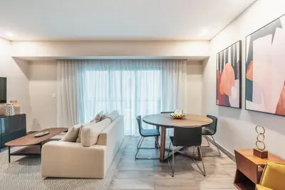a living room with a couch and a table at Breakfast Included at Regatta Living II 203 in Los Prados