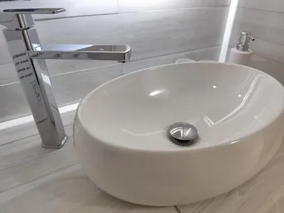 a white sink in a bathroom with a faucet at Villa Preciosa in Bayahibe