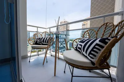 a balcony with chairs and a table on a balcony at Stunning view of the city. in Santo Domingo