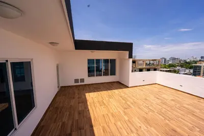 a large room with a wooden floor and a balcony at Stunning view of the city. in Santo Domingo