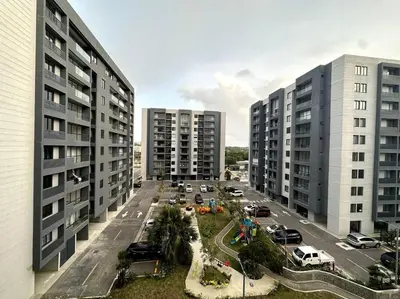 an aerial view of a parking lot with tall buildings at Premium space in Santiago- 5 Min Away from airport in Santiago de los Caballeros