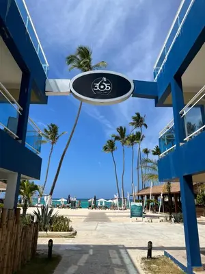a frisbee hanging from a blue building next to the beach at Casa Mulata Paseo del Mar Pool & Playa in Punta Cana
