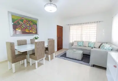 a living room with a couch and a table at MB Apartment - A in San Felipe de Puerto Plata