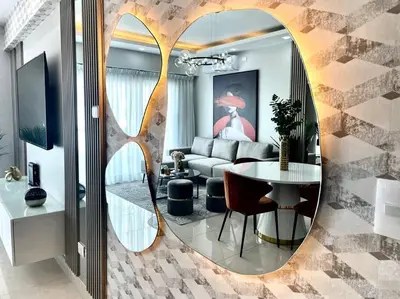a living room with a table and a mirror at VIP DELUXE AND TOWER J7_POOL_GYM_SAUNE_WIFE in Santo Domingo