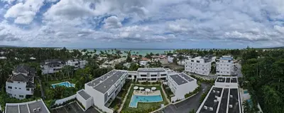 an aerial view of a building with a pool at 3 Bedroom Beach Villa With Parking in Las Terrenas
