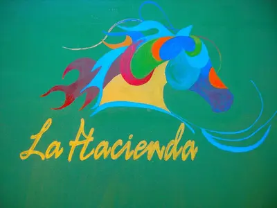 a painting of a unicorn with the words la florencia at La Hacienda Hostel-Rancho in Las Galeras
