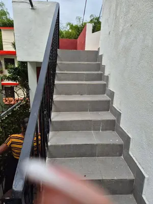 a set of stairs leading up to a building at R.G sol 2 in Pantoja