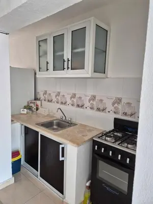 a kitchen with a sink and a stove at R.G sol 2 in Pantoja