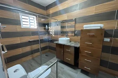 a bathroom with a shower and a toilet and a sink at Apart hotel Costa Verde Exclusivo y Seguro #5 con cama Queen in Las Galeras