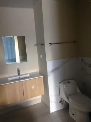 a bathroom with a toilet and a sink at Casa Larimar 214 - Vibe Residence in La Laguna