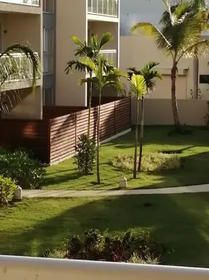 a house with palm trees and a fence at Casa Larimar 214 - Vibe Residence in La Laguna