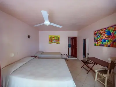 a bedroom with a bed and a ceiling fan at Villa La Plantacion in Las Galeras
