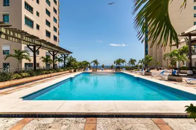a swimming pool in the middle of a building at 3 BDR Ocean View luxury Apartment . Sleeps 6 in Santo Domingo