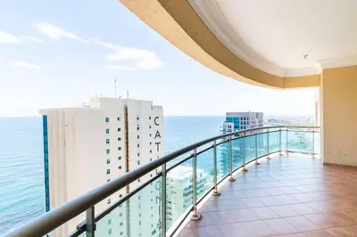 a view of the ocean from the balcony of a building at 3 BDR Ocean View luxury Apartment . Sleeps 6 in Santo Domingo