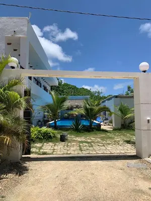 a view from the courtyard of a building with a pool at VILLA GRANDEZZA in Punta Cana