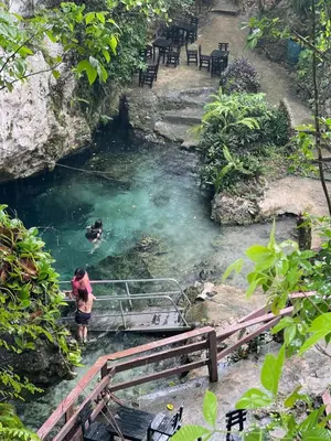 a person standing in a pool of water at Our Cozy Home, Wi-Fi, AC, Parking, Near Beaches and Attractions in quiet area in Nagua
