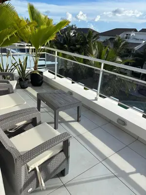 a balcony with chairs and tables and palm trees at Luxury Apartment Dominicus in La Laguna
